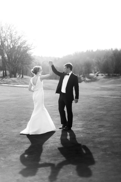 Longue Vue Club Wedding: Groom Twirls Bride on Golf Course
