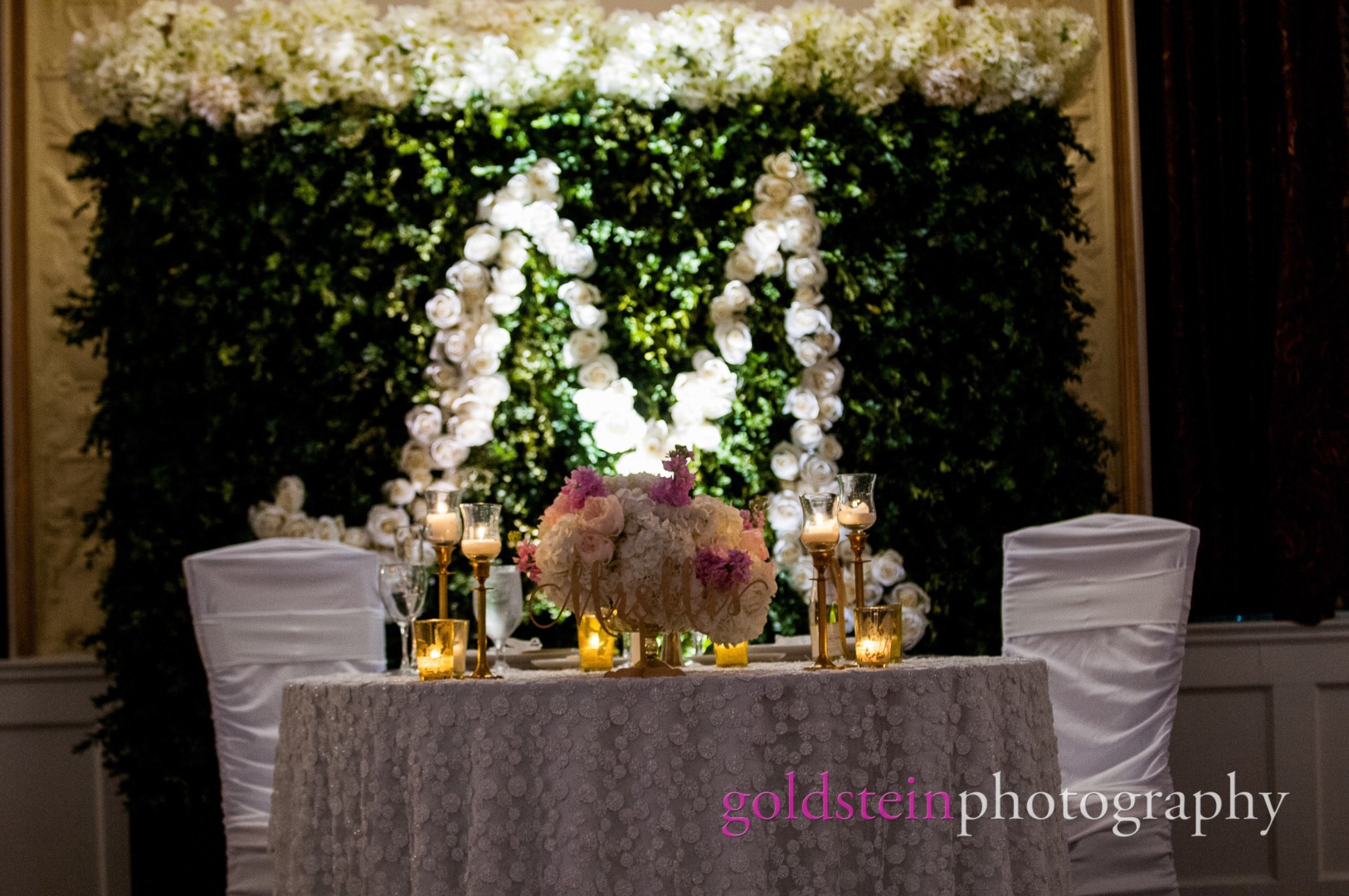 Bride Groom Sweetheart Table with Floral Monogram of Leaves & White Flowers at their wedding